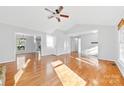 Bright, open living room featuring hardwood floors, vaulted ceiling, and views to other rooms at 2124 Marquesas Ave, Tega Cay, SC 29708