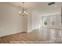 Bright, open living space with hardwood floors and plenty of natural light from large windows at 282 Gilead Rd, Huntersville, NC 28078