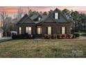 Charming brick home featuring a manicured lawn and mature landscaping at 304 Wintergreen Ct, Kings Mountain, NC 28086