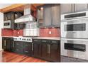 Modern kitchen boasts stainless steel appliances, sleek cabinetry, and a stylish backsplash, perfect for cooking enthusiasts at 3249 Ivey Creek Rd, Maiden, NC 28650