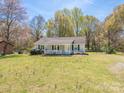 Charming single-story home with a cozy front porch and a large yard at 524 Catawba N Cir, Matthews, NC 28104