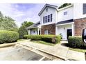 Charming exterior of home with brick and vinyl siding and manicured landscaping at 6359 Mallard View Ln, Charlotte, NC 28269