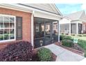 Relaxing screened porch, ideal for entertaining or enjoying quiet moments outdoors at 8518 Christalina Ln, Denver, NC 28037