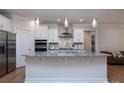 Modern kitchen with stainless steel appliances, granite countertops, and a stylish backsplash at 938 Moose Trl, Matthews, NC 28104