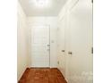 Hallway with hardwood floors, bright white walls, and a well-lit space at 106 Jason Ct, Fort Mill, SC 29715