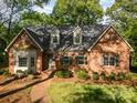 Well-maintained brick home with manicured landscaping at 119 Lakenheath Ln, Matthews, NC 28105
