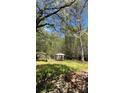 Expansive backyard with a gazebo and lush lawn, ideal for outdoor enjoyment and entertaining at 1232 Rosada Dr, Charlotte, NC 28213
