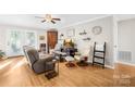 Comfortable living room with hardwood floors, a ceiling fan, and a neutral color palette at 1628 Rosegate Ln, Stanfield, NC 28163