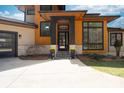 Inviting front entrance with modern door, decorative planters and contemporary architectural details at 233 Conifer Way, Shelby, NC 28150