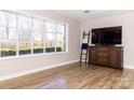 Bright living area boasts hardwood floors, a large window for ample light, and neutral wall paint at 2650 31St Street Ne Ct, Hickory, NC 28601