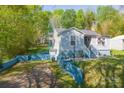 Home featuring fresh exterior paint, mature landscaping, and a side entry basement at 4445 Pioneer Dr, Hickory, NC 28601