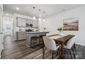 Eat-in kitchen boasts stainless appliances, gray cabinets and granite countertops at 4754 Lakeview N Rd # 19, Charlotte, NC 28216