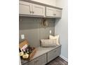 Cozy mudroom with custom cabinetry, bench seating, hooks, and stylish decor for organized entryway at 5103 Orchardview Way # 27, Charlotte, NC 28216