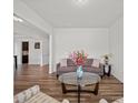 Cozy living room featuring hardwood floors, neutral decor, and an open layout perfect for entertaining at 9582 Creighton Nw Rd, Concord, NC 28027