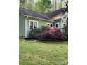 Well-maintained home with a lush lawn and mature landscaping, showcasing the property's beautiful outdoor space at 113 Duval Ct, Mooresville, NC 28117