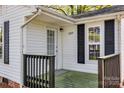 Close-up of the front porch of a home featuring dark wood railing, white trim, and well-maintained exterior at 1157 Cedar Grove Ln, Rock Hill, SC 29732