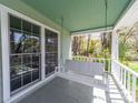 Relaxing porch view with a classic swing, offering serene outdoor living at 1206 Heatherloch Dr, Gastonia, NC 28054