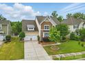 Well-maintained home with a two-car garage, lush lawn, and mature trees in a desirable neighborhood at 1224 Screech Owl Rd, Waxhaw, NC 28173