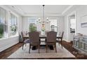 Well-lit dining room with a large table, comfortable seating, and elegant decor at 1255 Fishing Creek Rd, Clover, SC 29710
