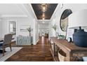 Inviting hallway featuring dark hardwood floors, stylish decor, and a view into other rooms at 1255 Fishing Creek Rd, Clover, SC 29710