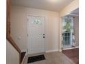 A foyer with decorative tile flooring and a staircase at 12604 Cardinal Point Rd, Charlotte, NC 28269