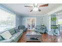 Inviting living room featuring stylish sofas, hardwood floors, and large windows at 12842 Plaza Road Ext, Charlotte, NC 28215