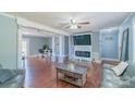 Spacious living room with fireplace, hardwood floors and lots of natural light at 12842 Plaza Road Ext, Charlotte, NC 28215