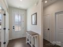 Inviting foyer with a wooden table, hardwood floors, and a well-lit entrance at 152 Amerson Dr, Rock Hill, SC 29730