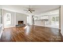 Bright living room with hardwood floors, a brick fireplace, an open floor plan, and lots of natural light at 1849 Harris Rd, Fort Mill, SC 29708