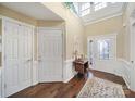 Bright foyer with hardwood floors, high ceilings, decorative front door, and transom windows at 2158 Hartwell Ln, Fort Mill, SC 29707