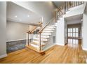 Inviting foyer with hardwood floors, staircase with white railings, and natural light at 2515 Barrington Ct, Rock Hill, SC 29732