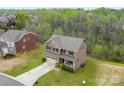 Aerial view of a well-maintained two-story home with a spacious yard and mature trees at 2548 Flintshire Ln, Gastonia, NC 28056