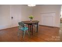 Bright dining room featuring hardwood floors and vintage table set at 35 E Catawba St, Belmont, NC 28012
