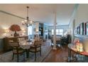 Inviting dining room with hardwood floors, chandelier, wainscotting and open floor plan at 403 Garner Dr, Salisbury, NC 28146