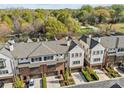 Stunning aerial view of the townhome community surrounded by lush greenery and trees, offering a serene living environment at 4038 City Homes Pl, Charlotte, NC 28209