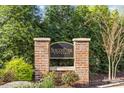 Elegant brick community sign for SouthPark City Homes, set amidst lush greenery and landscaping at 4038 City Homes Pl, Charlotte, NC 28209