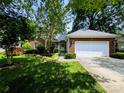 Well-manicured front yard of a brick home featuring a two-car garage and decorative landscaping at 4608 Mabry Pkwy, Rock Hill, SC 29732