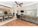 Open-concept living room featuring a fireplace, hardwood floors, and a seamless flow to the kitchen at 4767 Stratford Ln, Denver, NC 28037