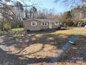 View of front yard of a single-story house at 5628 Anderson Rd, Charlotte, NC 28269