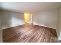 Spacious living room featuring hardwood flooring, neutral walls and recessed lighting at 5628 Anderson Rd, Charlotte, NC 28269