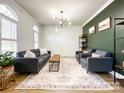 Comfortable living room with lots of natural light, stylish furniture and a cozy, inviting atmosphere at 6114 Abergele Ln, Matthews, NC 28104