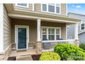 Inviting front porch with stone accents, offering a cozy spot to relax and enjoy the neighborhood view at 1430 Whitman Ct, York, SC 29745