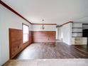 Open dining room offering wood accent wall and modern chandelier, perfect for Gathering meals at 1459 Wehunt Store Rd, Cherryville, NC 28021
