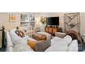 Inviting living room with plush white sofa, stylish decor, and ample natural light at 15041 New Amsterdam Ln, Charlotte, NC 28204