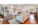 Cozy living room featuring a fireplace, built-in shelving, and comfortable seating for relaxing or entertaining at 1849 Oakmont Dr, Denver, NC 28037