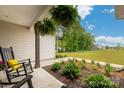 Manicured landscaping along the walkway highlights this expansive yard and outdoor living space at 2017 Autumn Dr, Monroe, NC 28110
