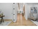 Bright entryway featuring hardwood floors, high ceilings, and an open view to the kitchen at 3038 Northampton Dr, Charlotte, NC 28210