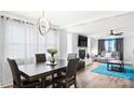 A living and dining area with modern decor, including an updated light fixture at 318 Lake Montonia Rd, Kings Mountain, NC 28086