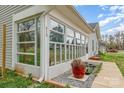 Bright sunroom with large windows offers natural light and outdoor views to the property at 413 E Henderson Es St, East Spencer, NC 28144