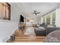 Cozy living room with a large sectional couch, hardwood floors, and natural light at 511 Plymouth Ave, Salisbury, NC 28144